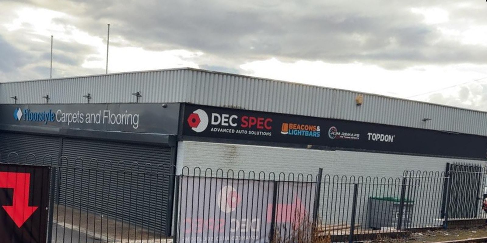 The Dec-Spec unit seen from the street, with the Dec Spec Advanced Auto Solutions sign above the workshop