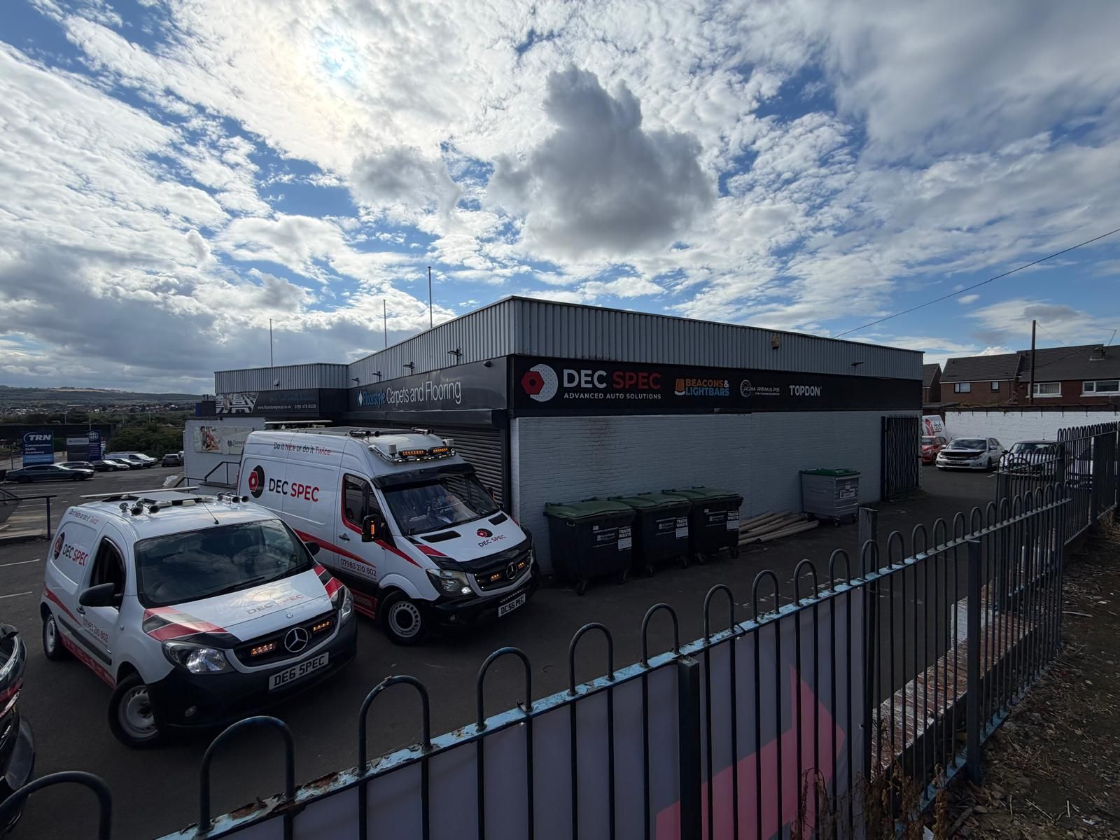 Two white Dec-Spec vans parked outside the Dec-Spec unit in Gateshead