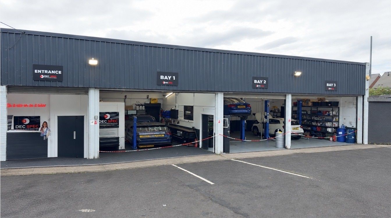 Dec-Spec workshop frontage with the entrance and Bays 1, 2 and 3, with cars in the bays